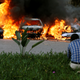 Cars are seen on fire at the scene of explosions and gunshots in Nairobi, Kenya January 15, 2019.